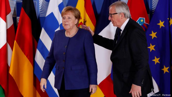 Ангела Меркель и глава Еврокомиссии Жан-Клод Юнкер на саммите ЕС, 24 июня 2018 года. Фото – Reuters